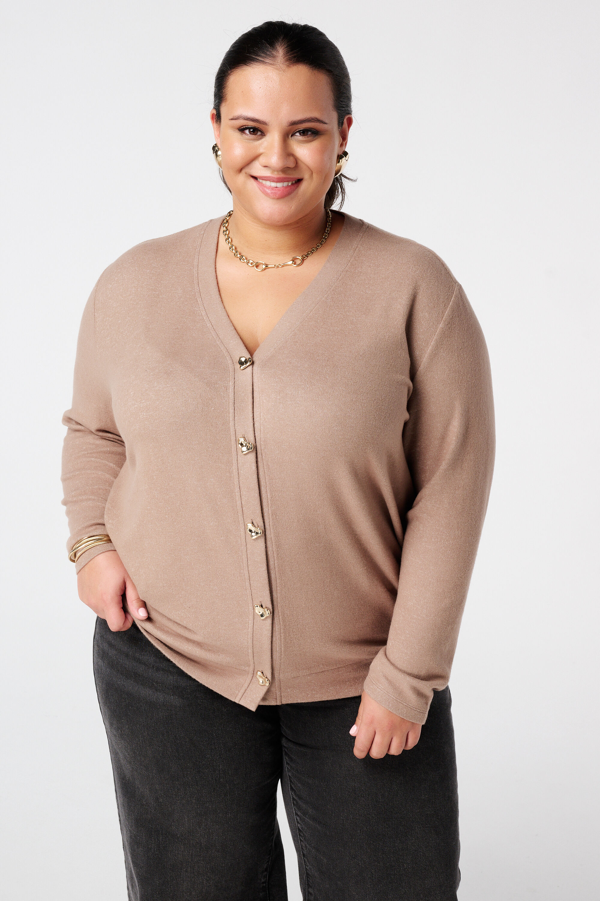 Vest met gouden hartjesknopen