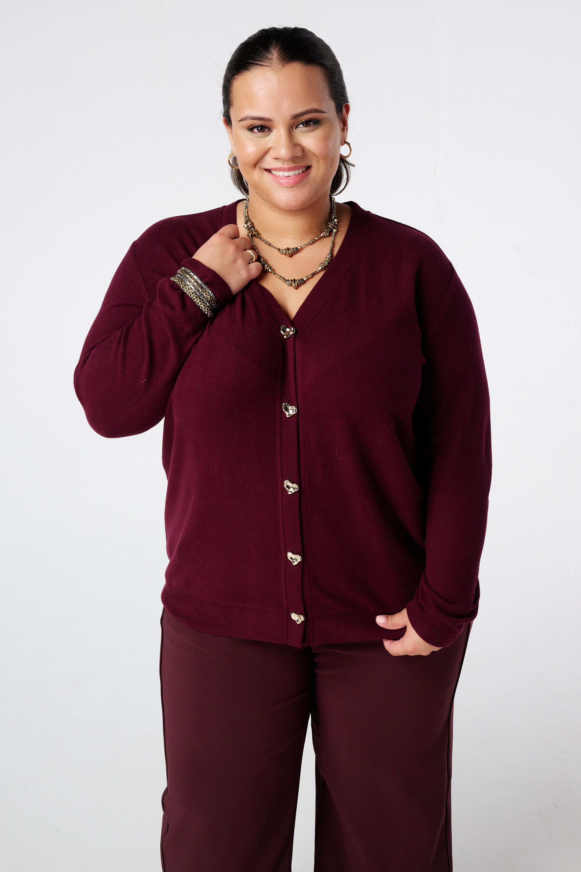 Vest met gouden hartjesknopen