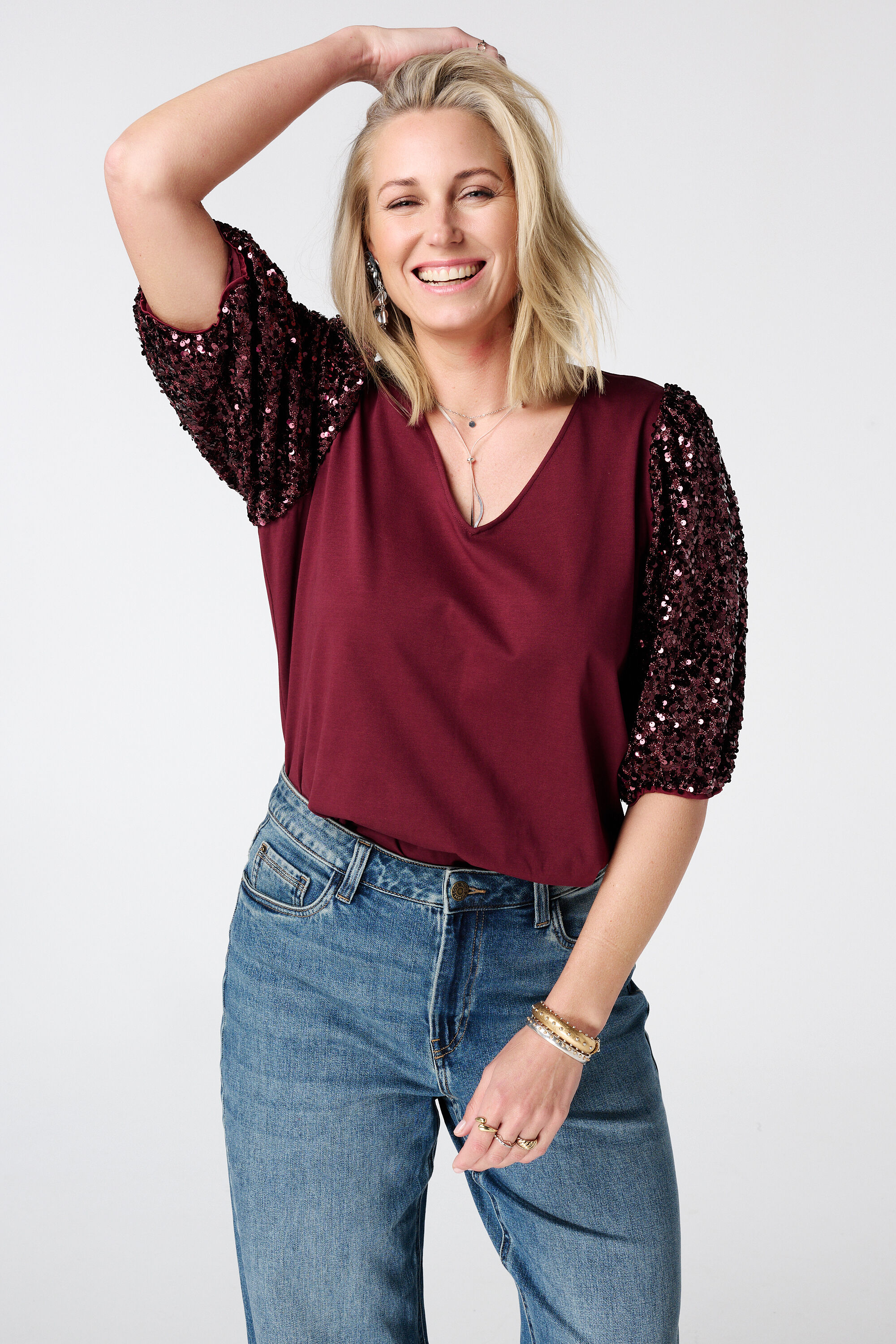 Top met pailletten pofmouwen